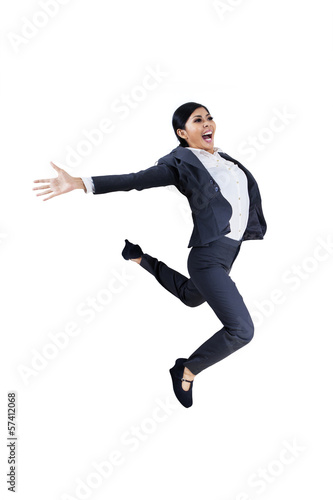 Happy businesswoman jumping - isolated