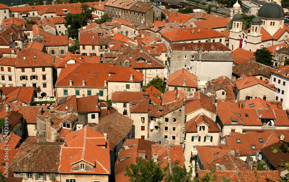 Panorama of old town with red sloped roofs of Kotor