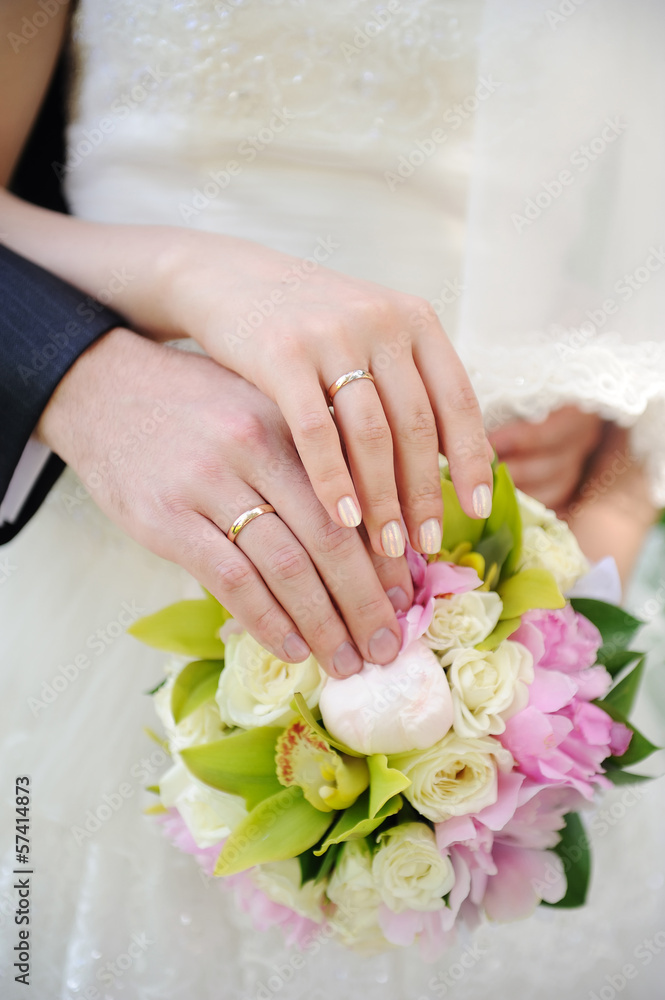 hands of the bride and groom together hands of the bride and groom together