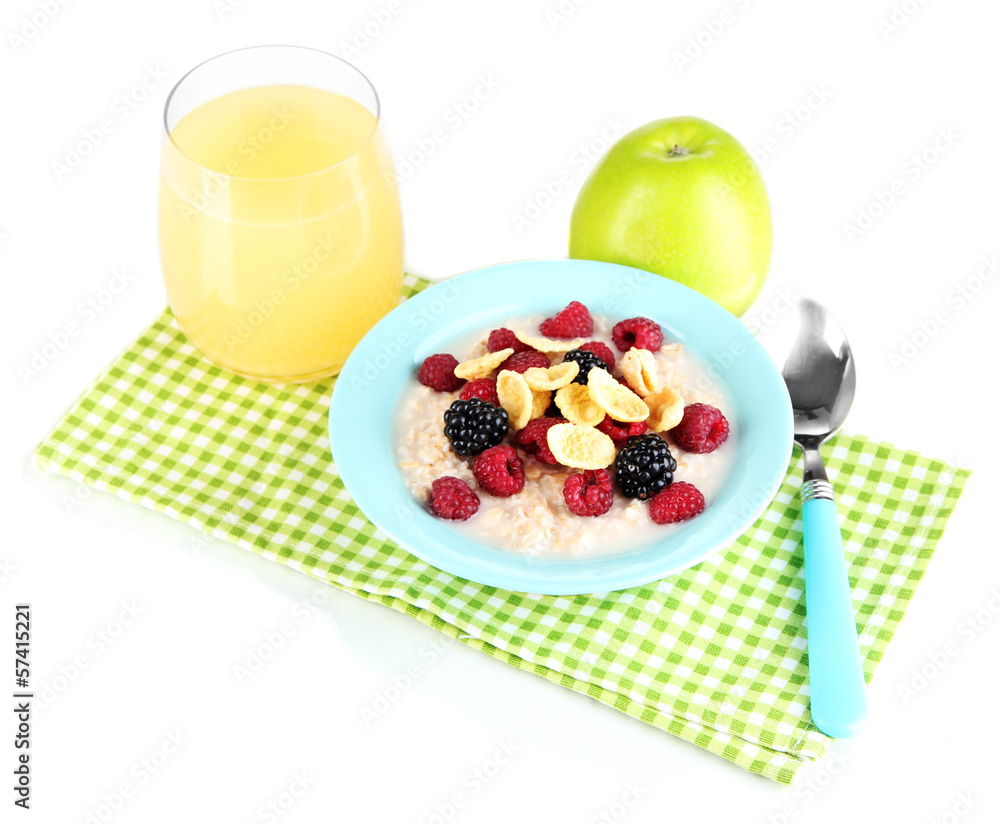 Oatmeal in bowl with berries isolated on white Oatmeal in bowl with berries isolated on white