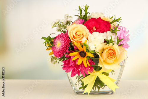 Fototapeta Naklejka Na Ścianę i Meble -  Beautiful bouquet of bright flowers in glass vase,