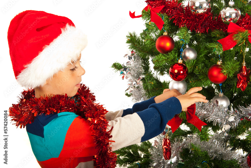 Boy decorate Christmas tree