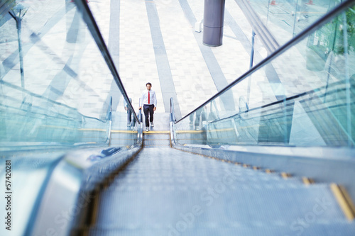 businessman on an escalator