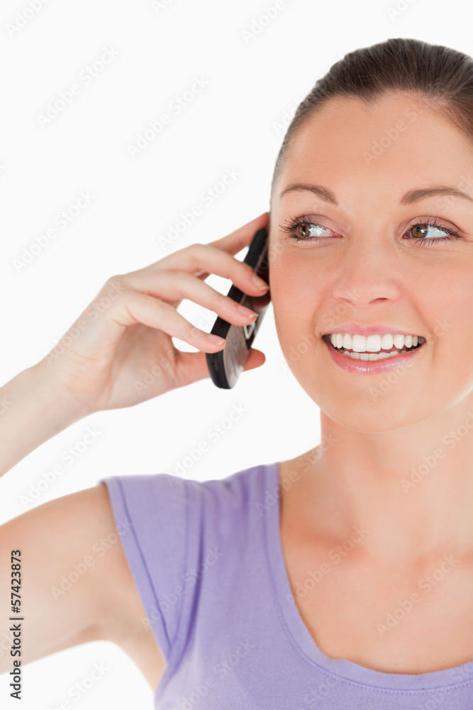 Portrait of a good looking female on the phone while standing Portrait of a good looking female on the phone while standing