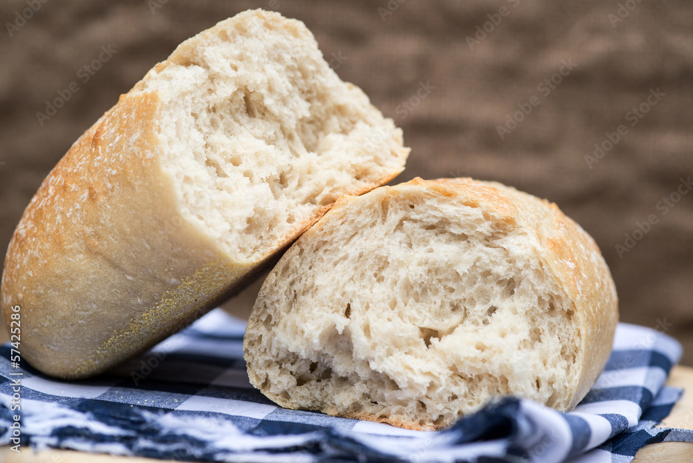 Fototapeta premium Loaf of sourdough bread in rustic kitchend setting