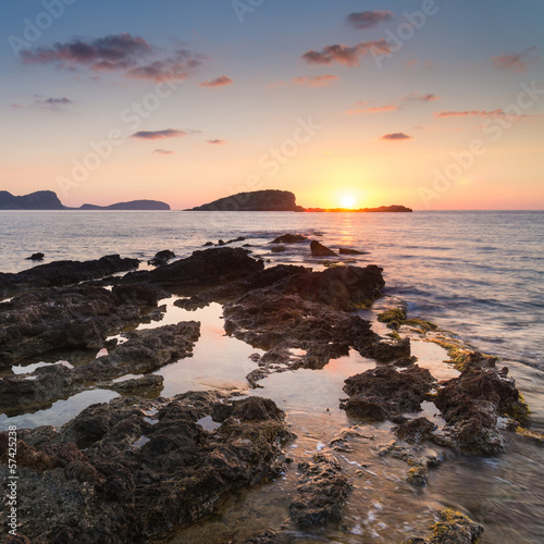 Stunning landscapedawn sunrise with rocky coastline and long exp © veneratio