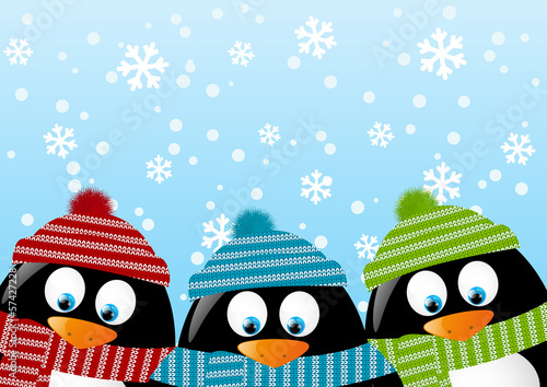 Cute penguins on winter background