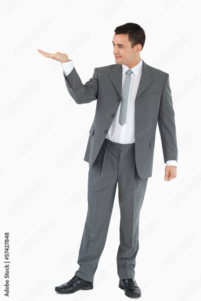 Businessman looking at what he is presenting Businessman looking at what he is presenting