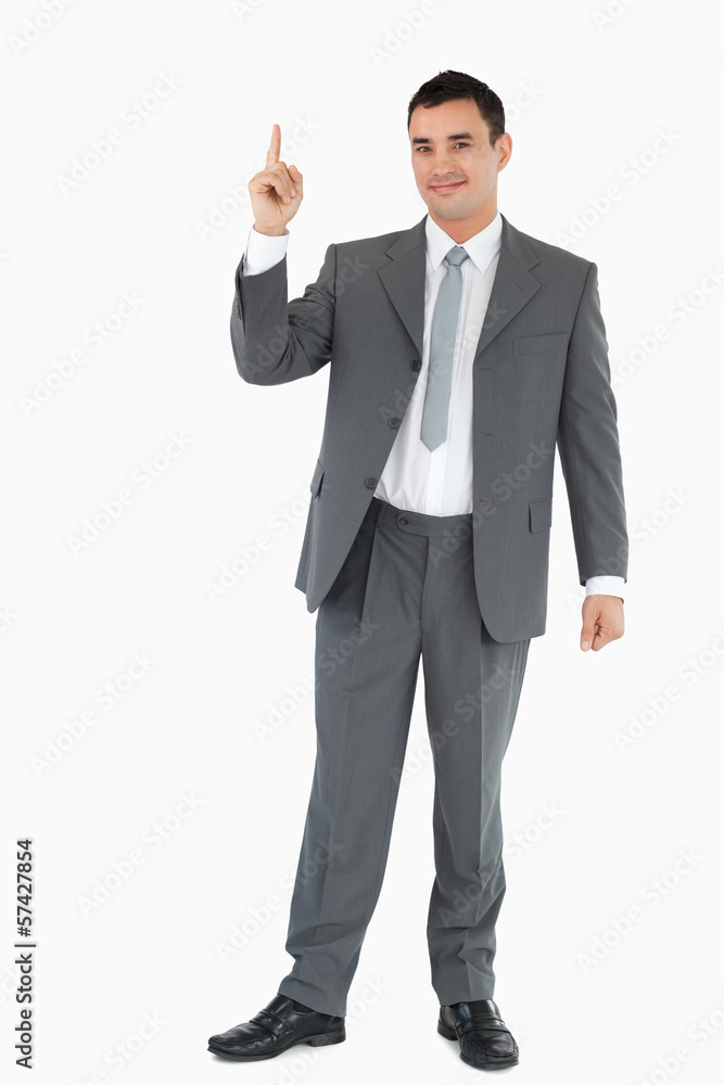 Businessman pointing upwards