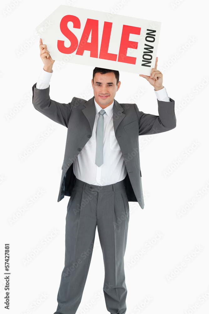 Businessman with sign above his head Businessman with sign above his head