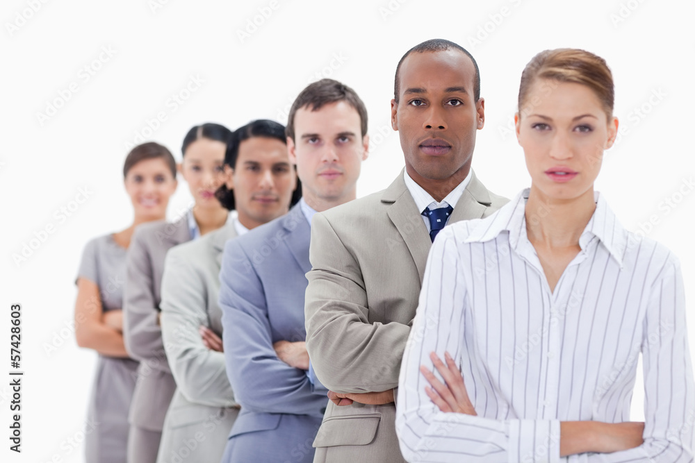 Close-up of colleagues dressed in suits crossing their arms in a Close-up of colleagues dressed in suits crossing their arms in a