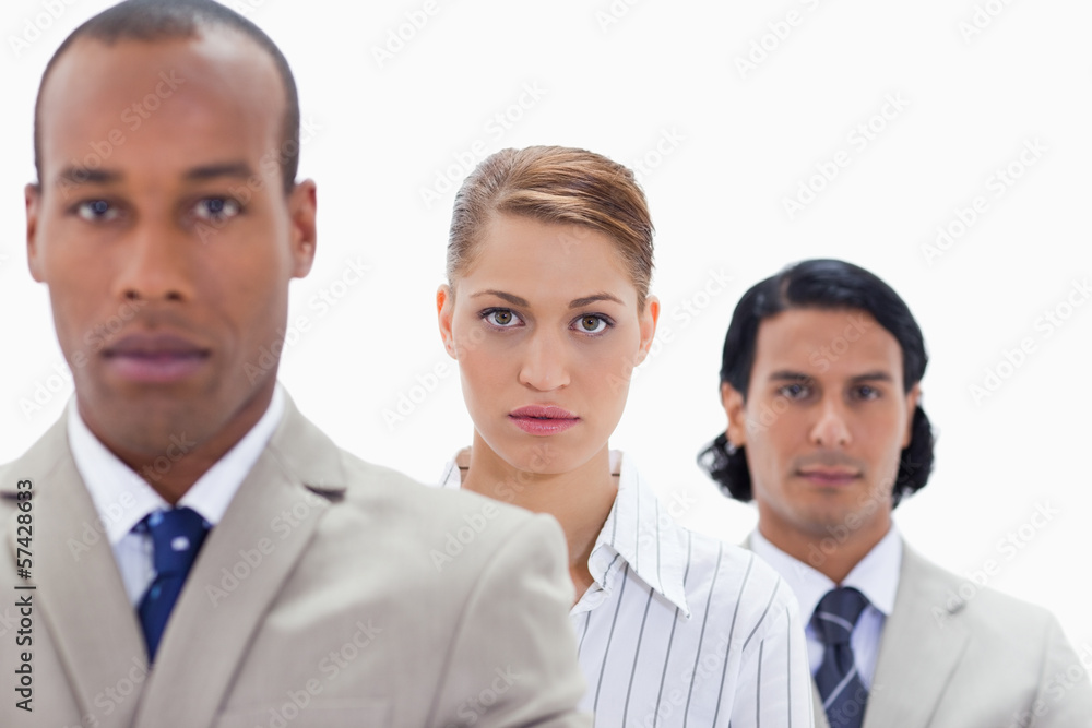 Big close-up of a serious business team in a single line Big close-up of a serious business team in a single line