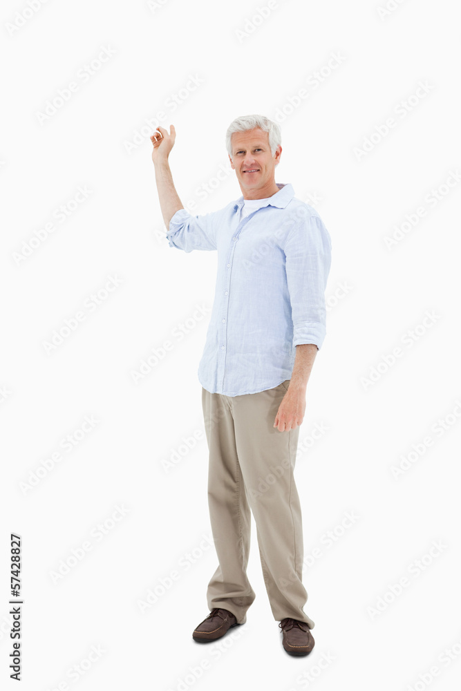 Portrait of a mature man pointing at something Portrait of a mature man pointing at something