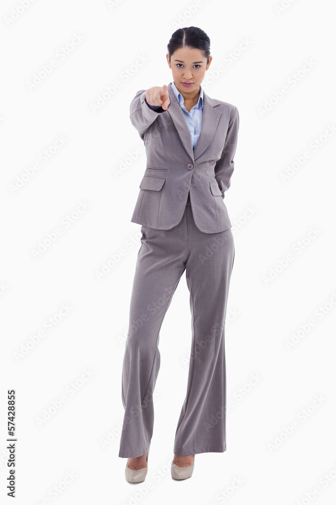 Portrait of a serious businesswoman pointing at the viewer Portrait of a serious businesswoman pointing at the viewer