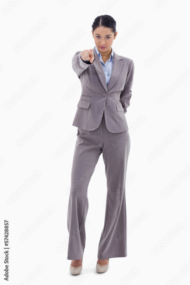 Portrait of a brunette businesswoman pointing at the viewer Portrait of a brunette businesswoman pointing at the viewer