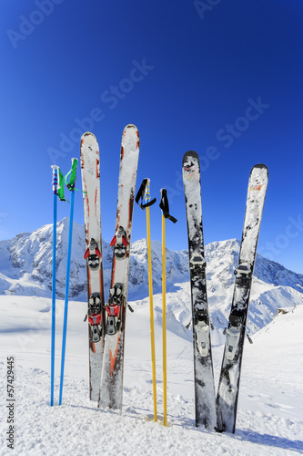 Skiing,  mountains and ski equipments on ski run