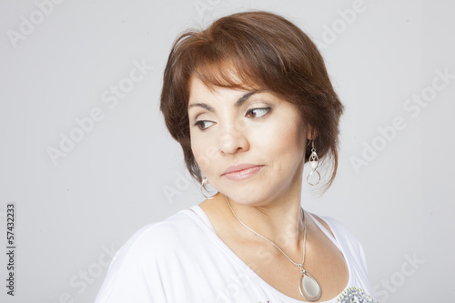latin pretty middle aged woman posing on white background