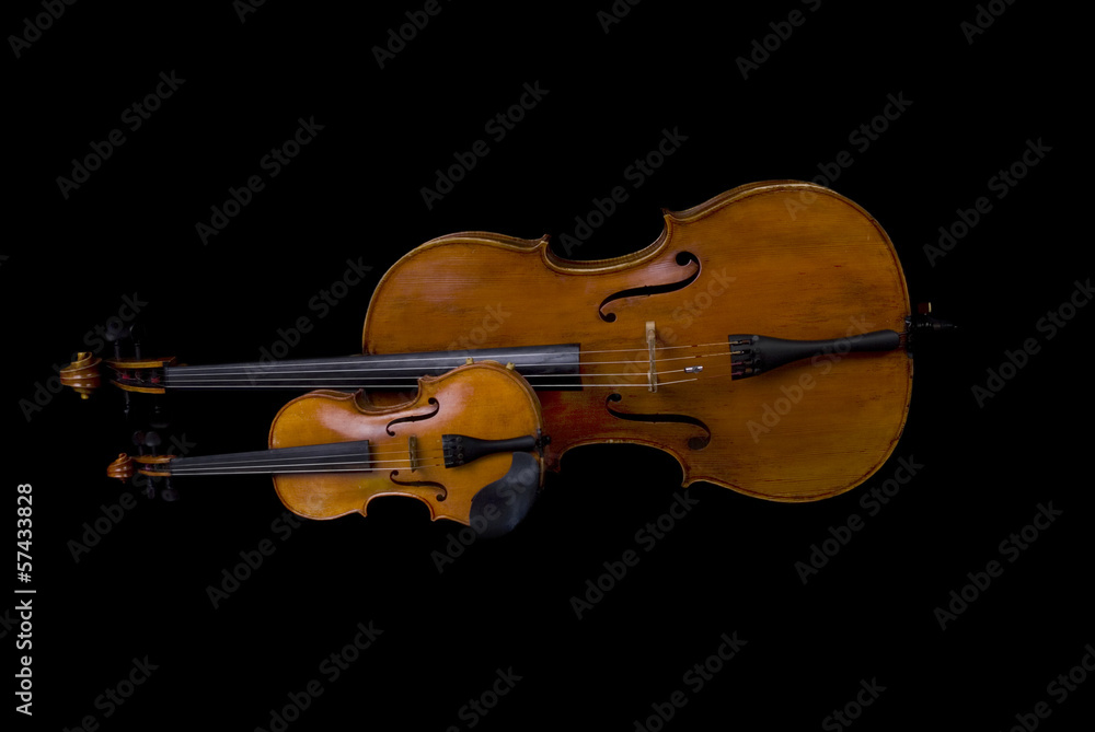 Fototapeta premium Violin and Cello isolated on black