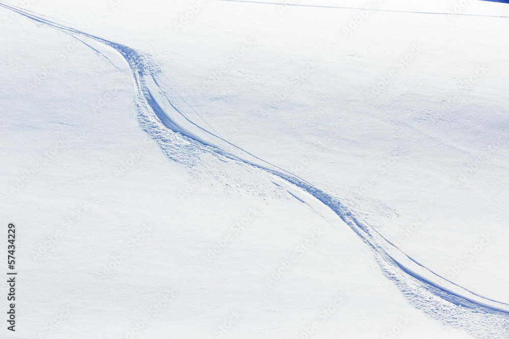 Ski background - freeride tracks on powder snow