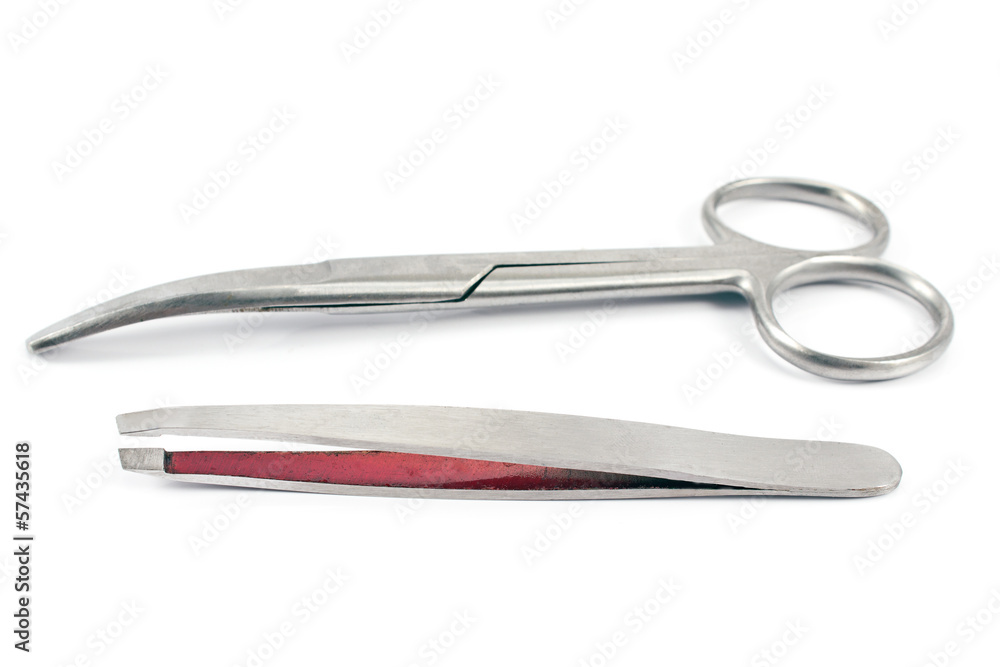Nail scissors with eyebrow tweezers isolated on white Nail scissors with eyebrow tweezers isolated on white