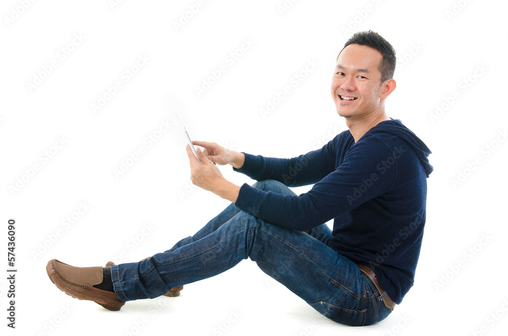 Young Asian student using pad PC isolated on white background. Young Asian student using pad PC isolated on white background.