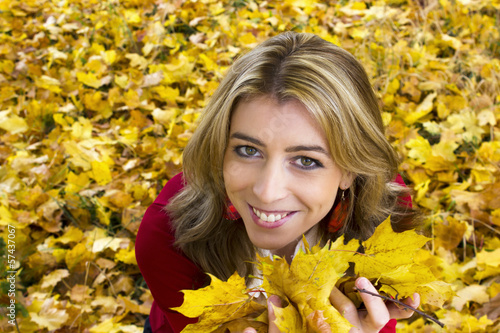 Beautiful woman with yellow leaves