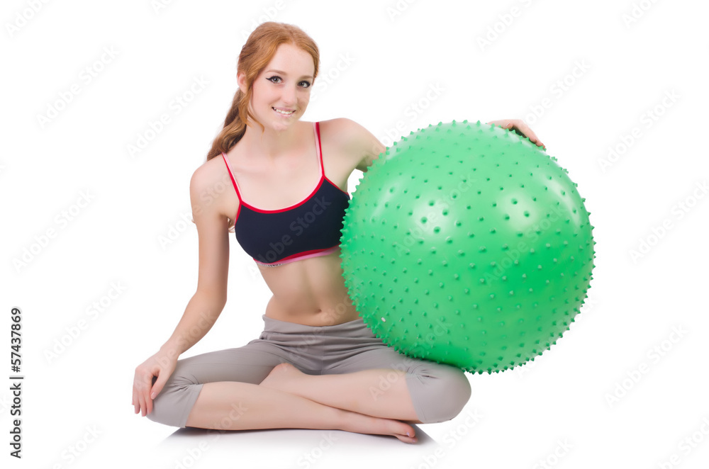 Fototapeta premium Woman exercising with swiss ball on white