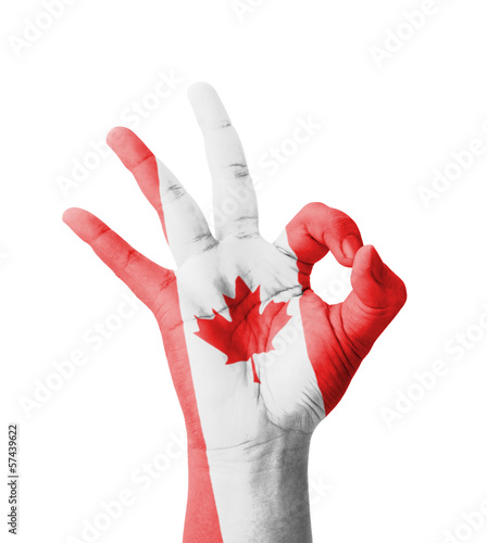 Hand making Ok sign, Canada flag painted