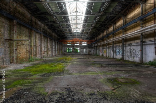 Abandoned hall with long windows