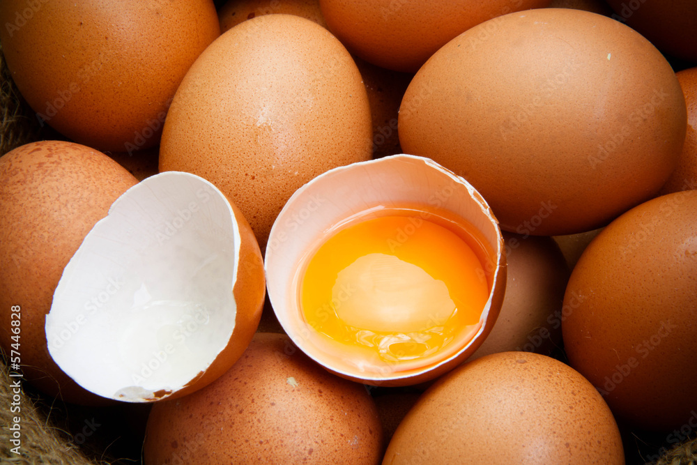 broken chicken eggs and egg yolk - obrazy, fototapety, plakaty 