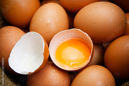 broken chicken eggs and egg yolk