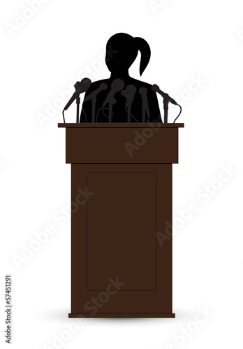 woman on a tribune before a microphone