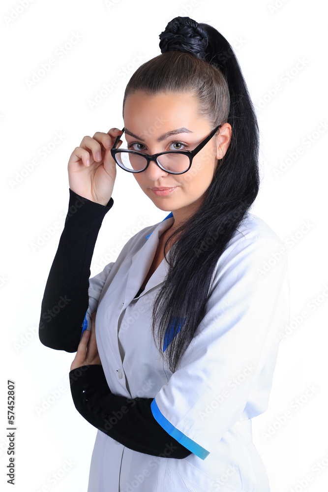 A portrait of a sexy beautiful female brunette doctor in a white A portrait of a sexy beautiful female brunette doctor in a white