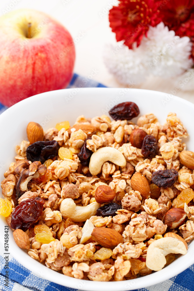 Fototapeta premium Healthy muesli breakfast with nuts and raisin