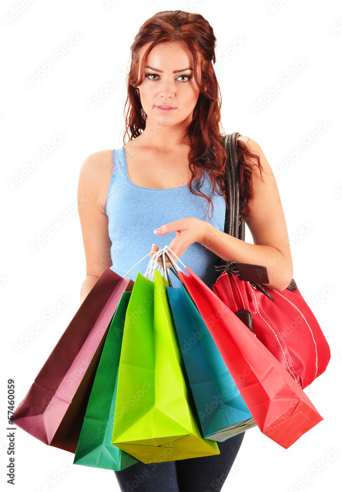 Young woman with shopping bags isolated on white Young woman with shopping bags isolated on white