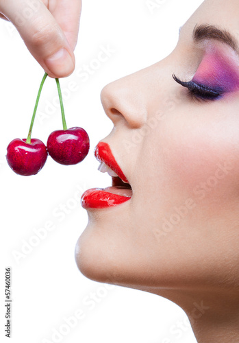 Close up of girl with red lips and bright makeup 