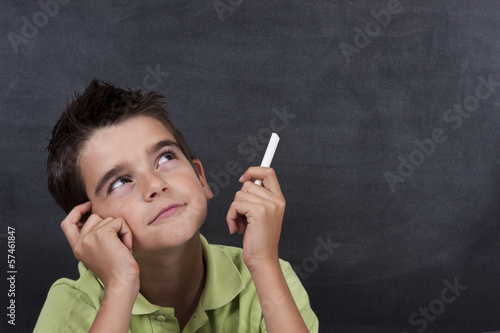 boy thinking on the board photo