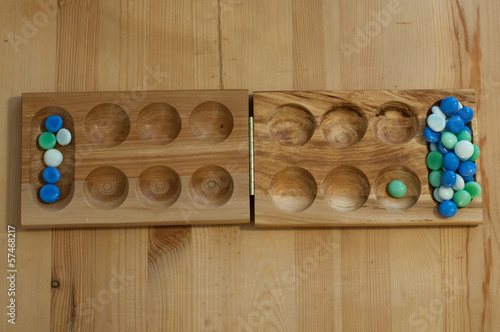 mancala, traditional board game photo