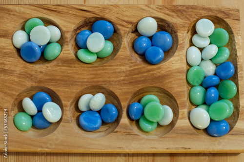 mancala, traditional board game photo