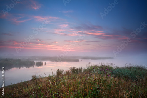 foggy sunrise over river