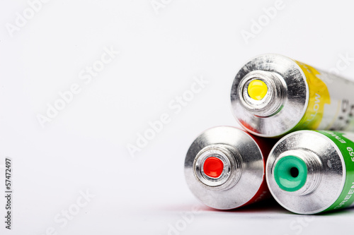 three squeezed artistic's paint tubes
