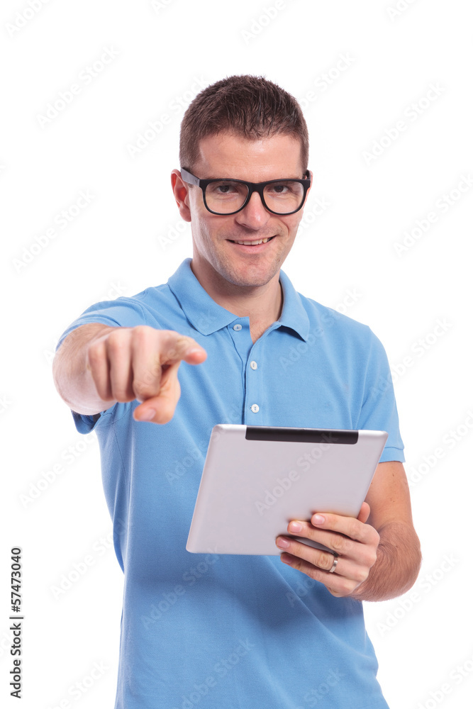 casual man with tablet is pointing at you casual man with tablet is pointing at you