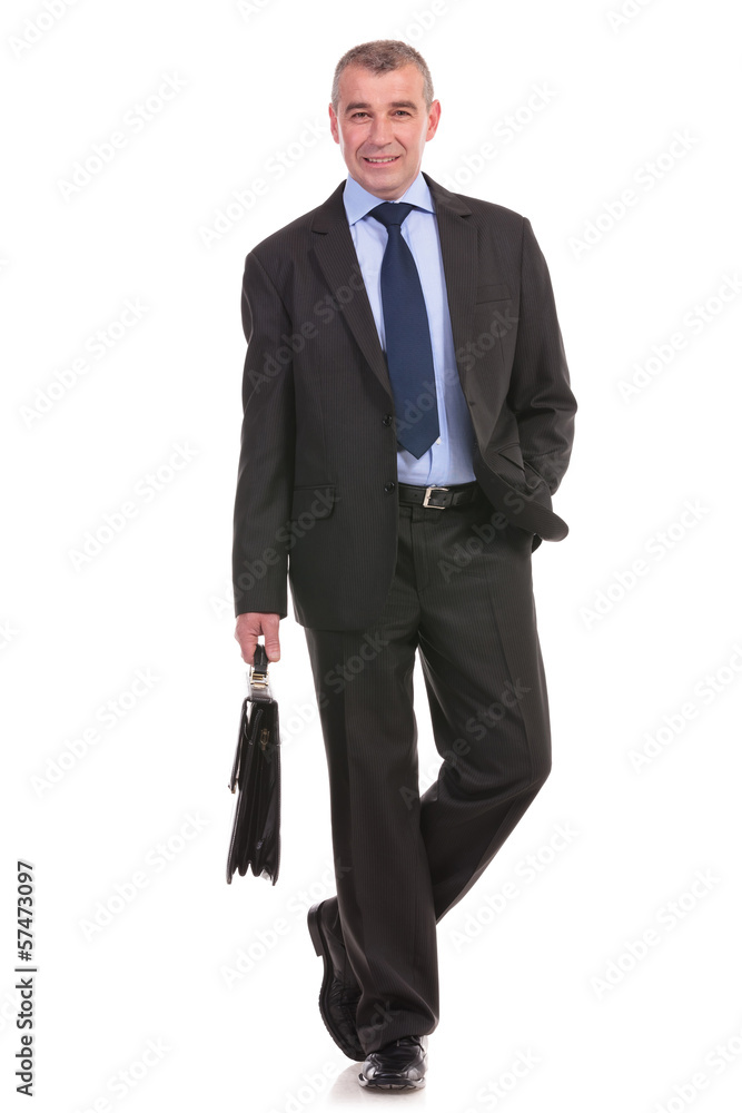 business man walks to the camera with brief in hand business man walks to the camera with brief in hand