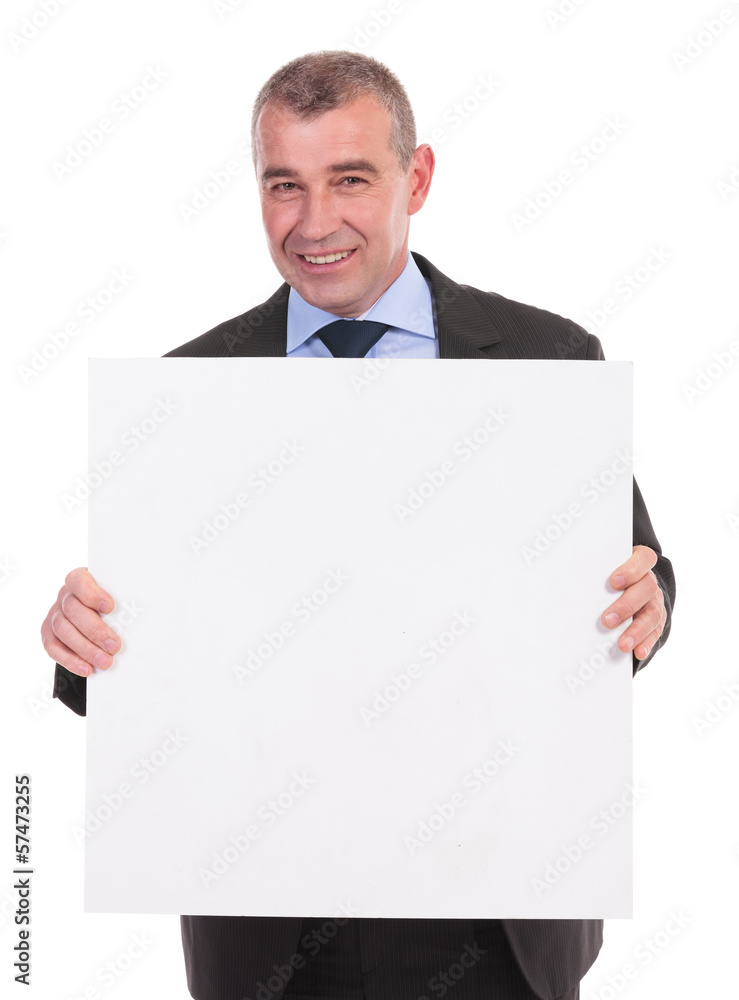 business man holds a small pannel with both hands business man holds a small pannel with both hands
