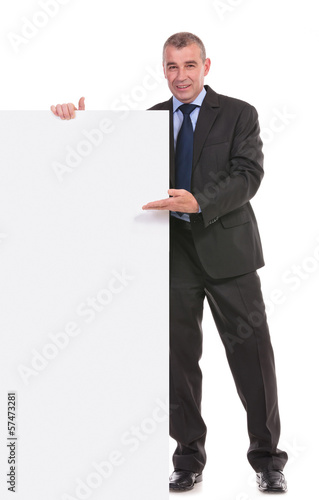 business man presents a blank board