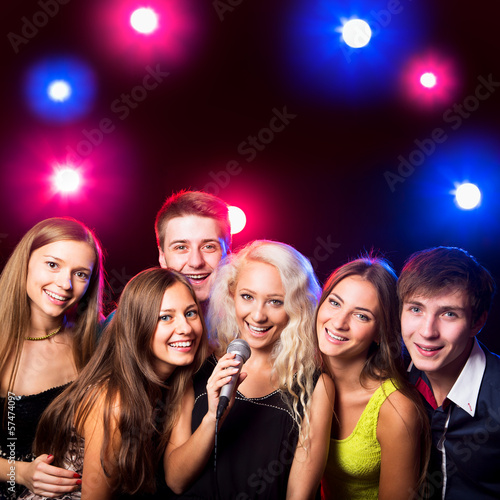 Young people singing at party