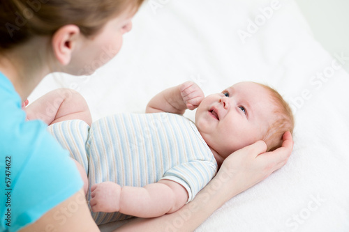 happy mother looking at her...