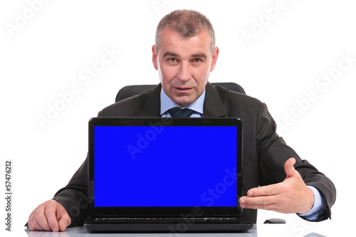 business man presents his laptop