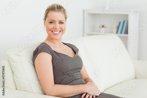 Woman sitting on a sofa