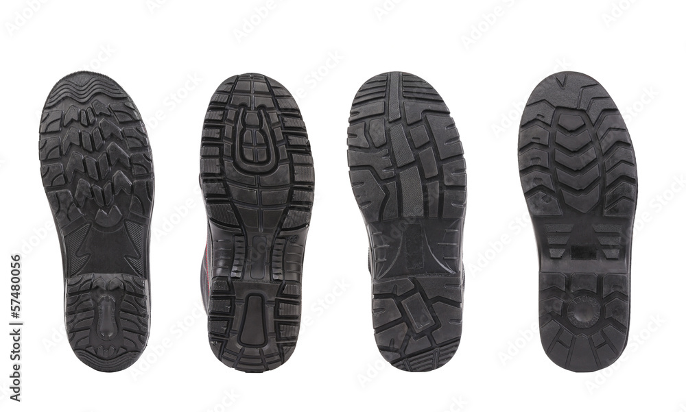 Four shoe soles in row. Four shoe soles in row.